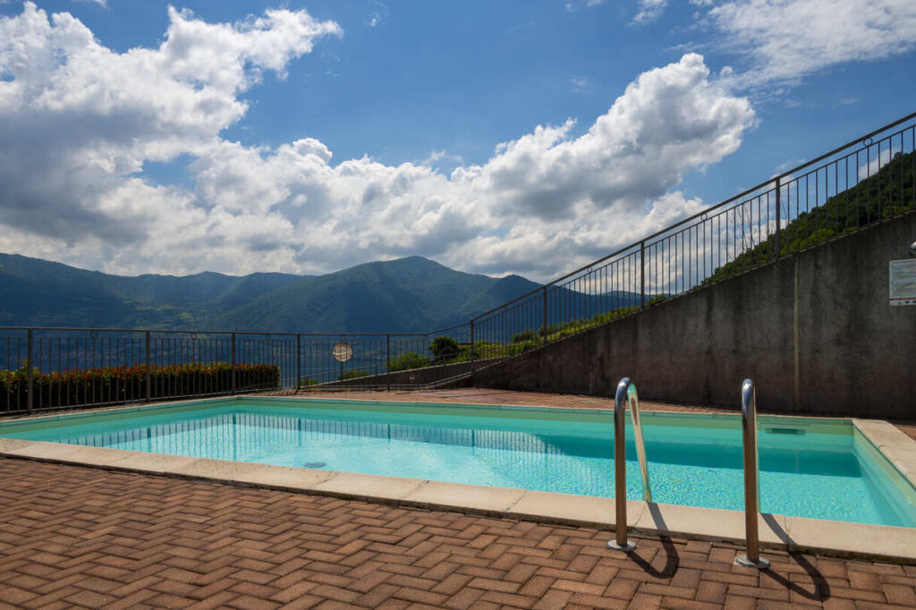 Outdoor swimming pool overlooking the lake and mountains